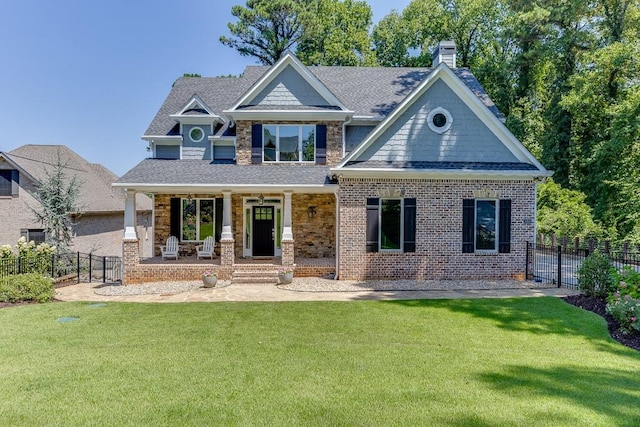 3441 Shoreland Dr, Buford, GA 30518 - craftsman-style home with covered porch, a shingled roof, and a chimney
