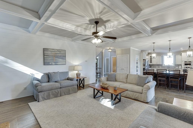 3441 Shoreland Dr, Buford, GA 30518 - living area with coffered ceiling, wood finished floors, a ceiling fan, beam ceiling, and ornamental molding