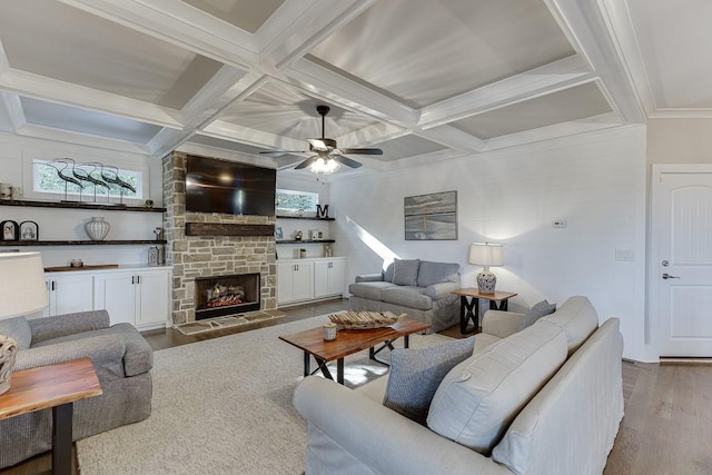 3441 Shoreland Dr, Buford, GA 30518 - living area with coffered ceiling, wood finished floors, plenty of natural light, a stone fireplace, and ceiling fan