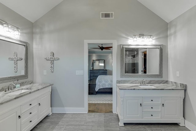3441 Shoreland Dr, Buford, GA 30518 - ensuite bathroom featuring lofted ceiling, two vanities, baseboards, a ceiling fan, and a shower