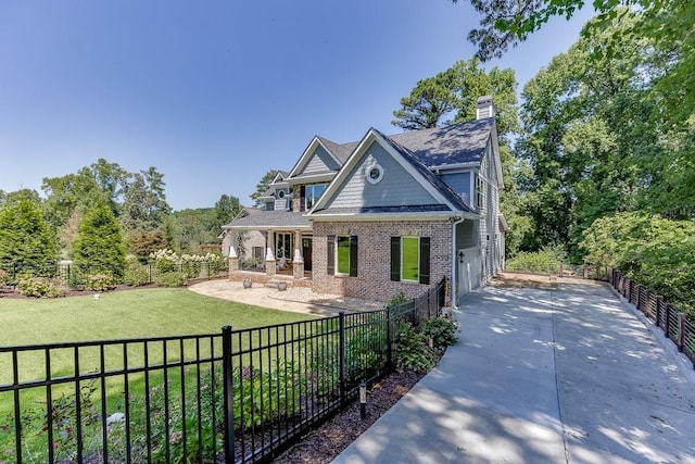 3441 Shoreland Dr, Buford, GA 30518 - view of front of property featuring driveway, brick siding, a chimney, and a garage