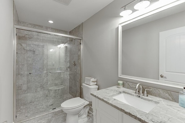 3441 Shoreland Dr, Buford, GA 30518 - bathroom featuring toilet, vanity, a stall shower, and recessed lighting