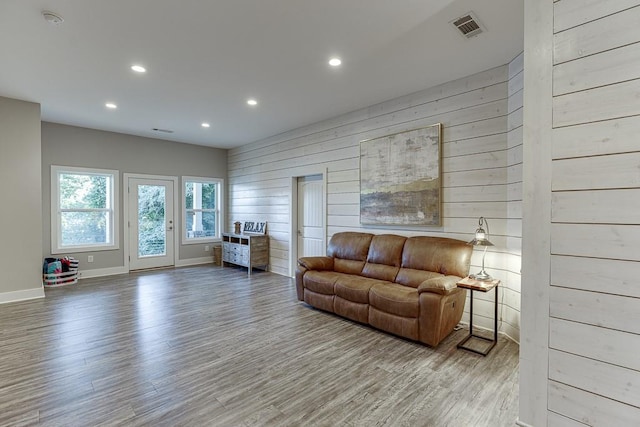3441 Shoreland Dr, Buford, GA 30518 - living area featuring recessed lighting, wood finished floors, wooden walls, and baseboards
