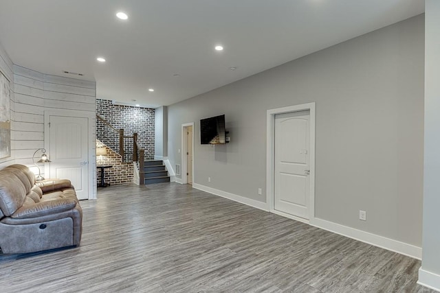 3441 Shoreland Dr, Buford, GA 30518 - living room featuring stairs, wood finished floors, recessed lighting, and baseboards