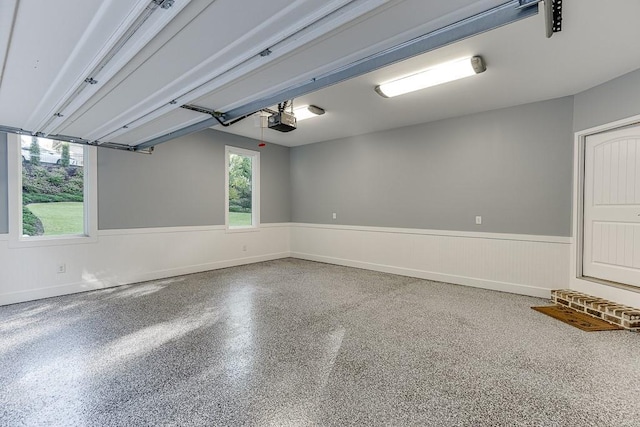 3441 Shoreland Dr, Buford, GA 30518 - garage with a garage door opener and wainscoting