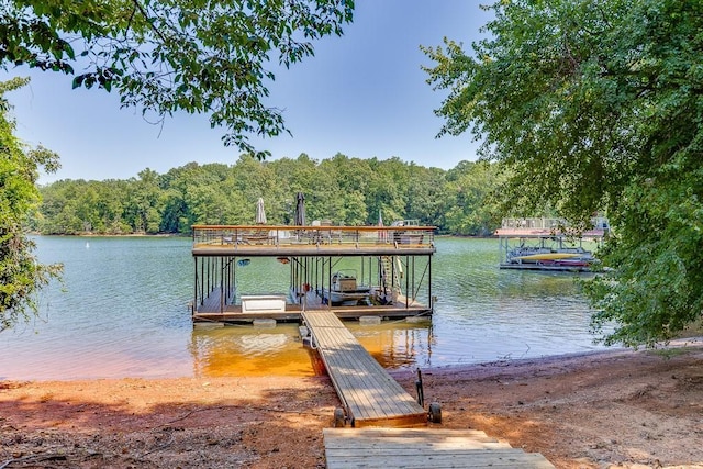 3441 Shoreland Dr, Buford, GA 30518 - dock featuring a water view and a forest view