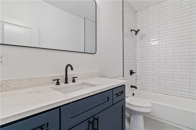 full bathroom with toilet, tile patterned flooring, vanity, and tiled shower / bath