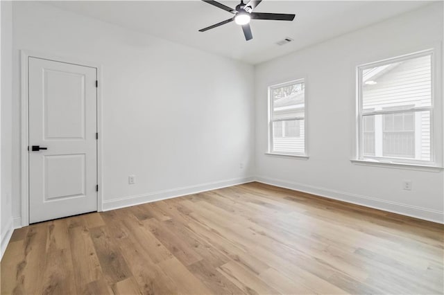 spare room featuring ceiling fan and light wood-type flooring