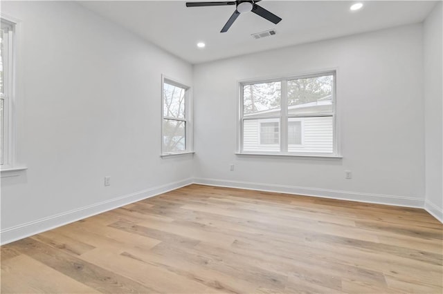 unfurnished room featuring light hardwood / wood-style flooring and ceiling fan