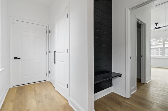 corridor featuring light hardwood / wood-style floors