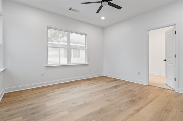 empty room with light wood-type flooring and ceiling fan