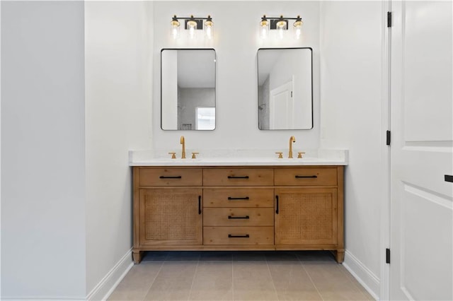 bathroom featuring tile patterned flooring and vanity