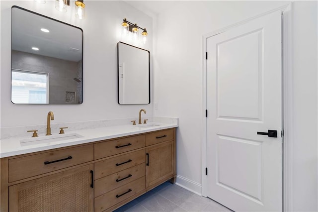 bathroom with tile patterned flooring and vanity