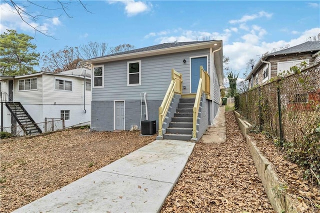 back of property with central AC unit