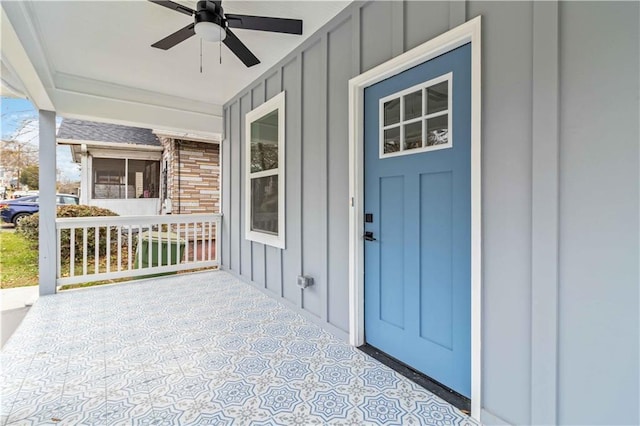 doorway to property with ceiling fan and covered porch