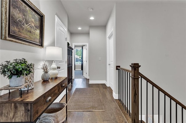 corridor featuring dark hardwood / wood-style flooring