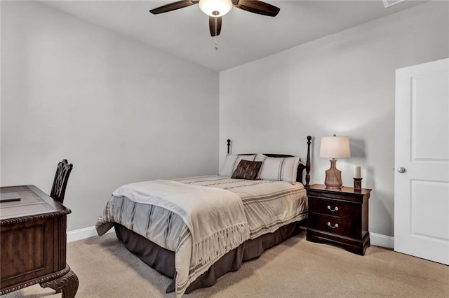 bedroom with light carpet and ceiling fan