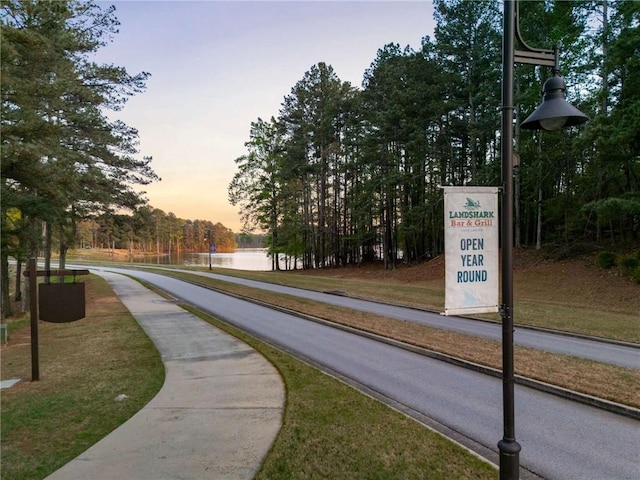 surrounding community with a water view
