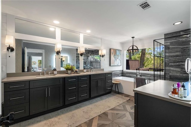 bathroom with vanity, baseboards, walk in shower, and tile patterned flooring