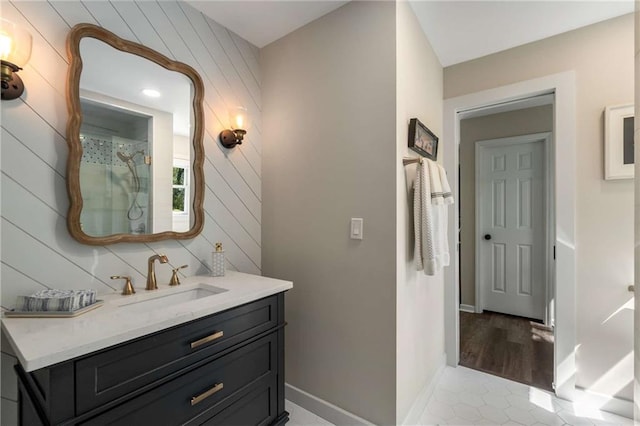 laundry area with separate washer and dryer, cabinet space, a ceiling fan, and wood finished floors