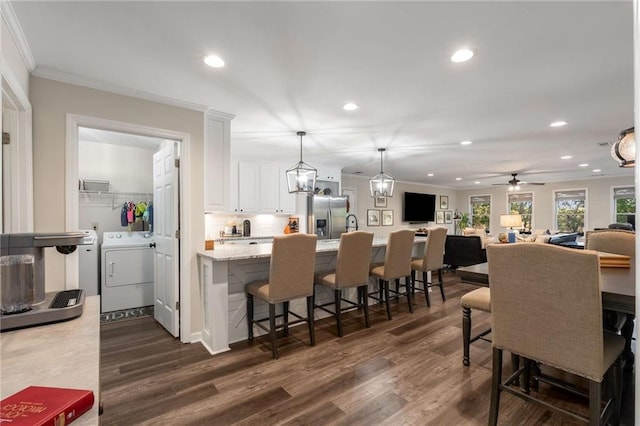 interior space with baseboards and wood finished floors