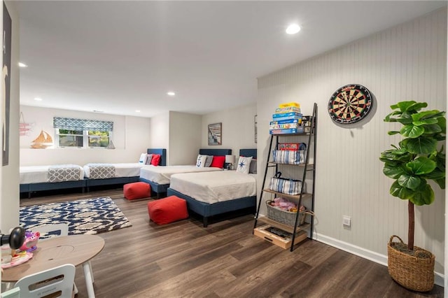 interior space with baseboards, recessed lighting, and wood finished floors