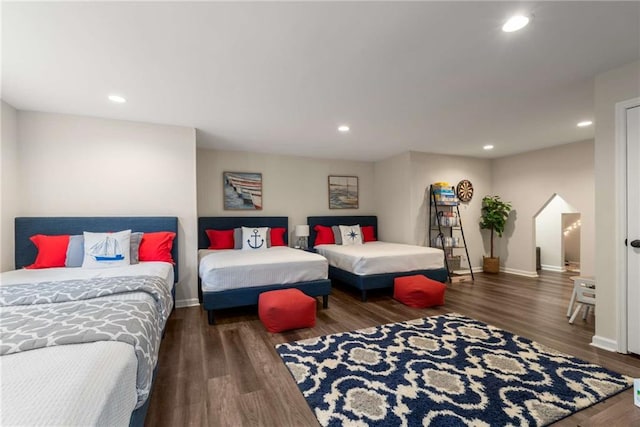 bedroom with dark wood-style flooring, baseboards, visible vents, and ceiling fan