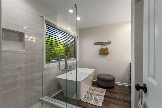 laundry area with a sink, dark wood-style floors, cabinet space, and washer and clothes dryer