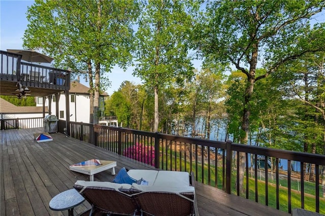 wooden deck featuring outdoor dining space
