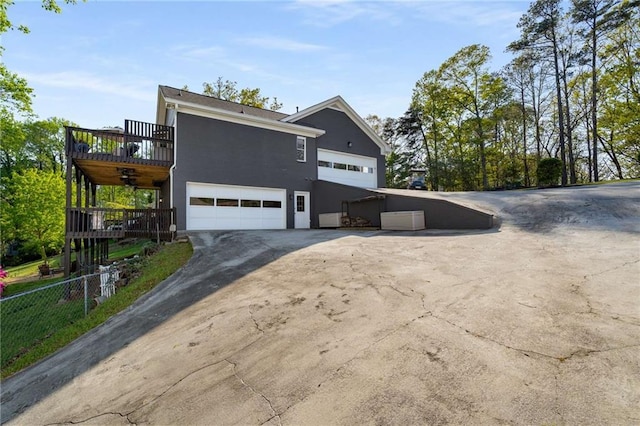 rear view of house featuring stairway, a lawn, a wooden deck, and a chimney