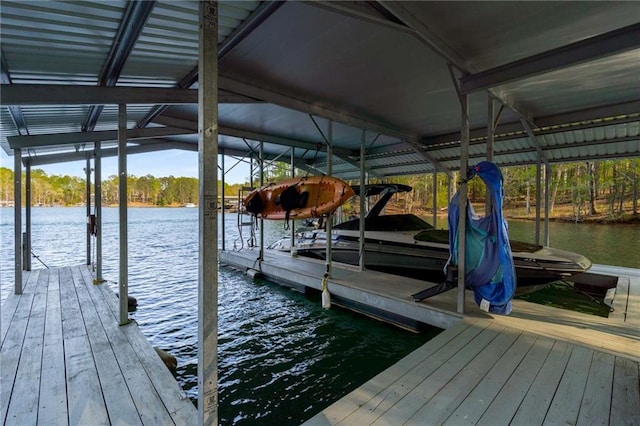 view of dock with a water view and boat lift