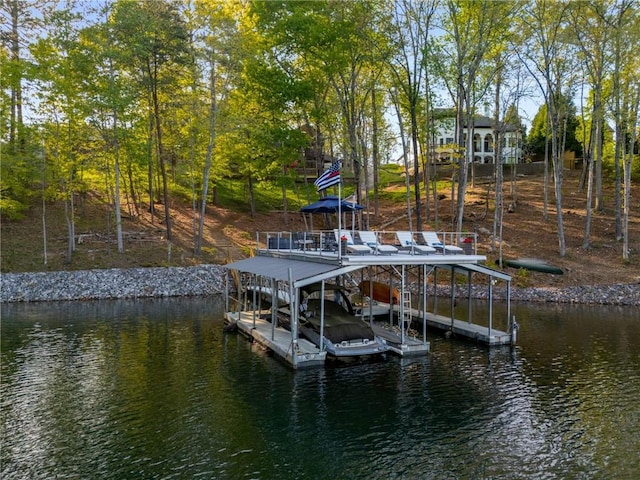aerial view featuring a water view, a residential view, and a forest view