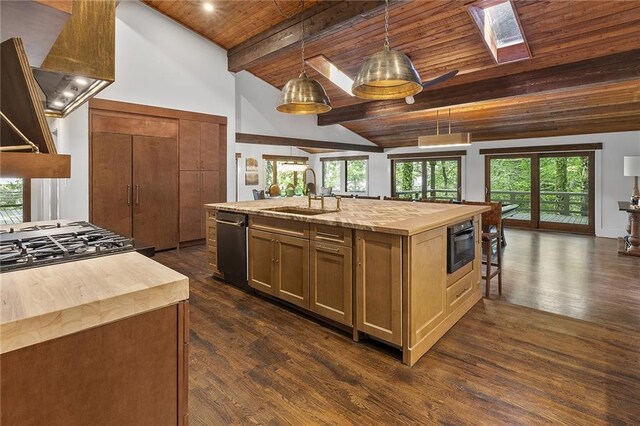 kitchen featuring an island with sink, wood ceiling, dark wood-type flooring, and lofted ceiling with skylight