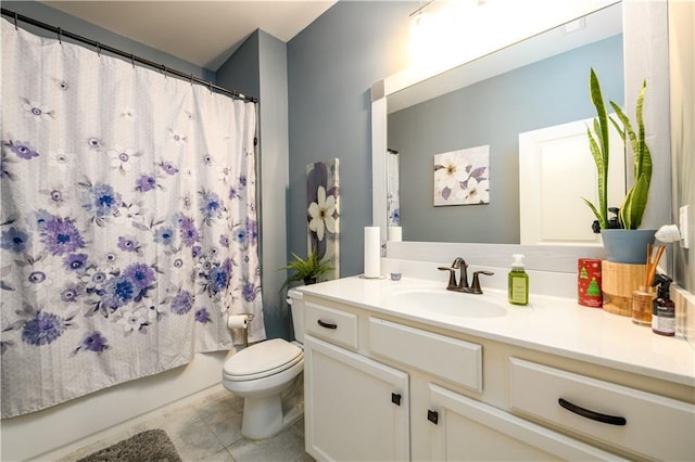 bathroom with toilet, vanity, tile patterned floors, and shower / bath combo