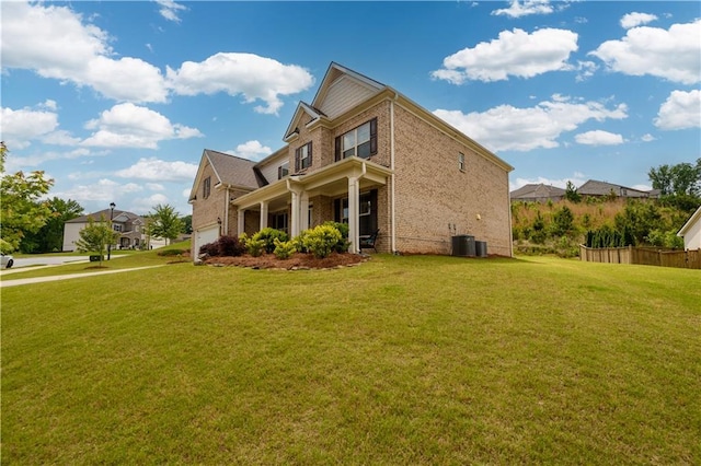 view of property exterior with brick siding, a garage, and central AC unit