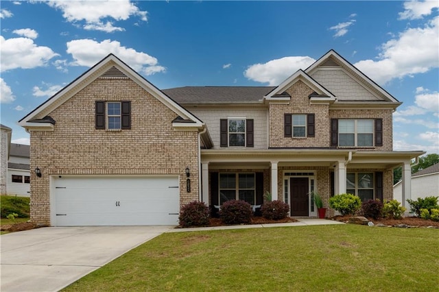 craftsman-style house with brick siding, a garage, concrete driveway, and a front lawn