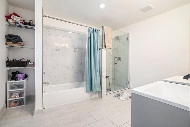 bathroom featuring visible vents, shower / tub combo with curtain, and vanity