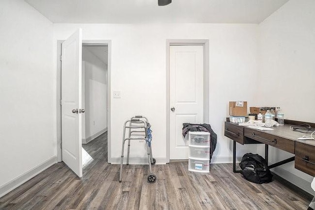 office with baseboards and wood finished floors