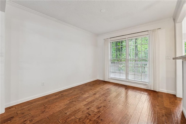 2986 Edenberry Ln NW, Kennesaw, GA 30152 - empty room with crown molding, hardwood / wood-style flooring, baseboards, and a textured ceiling