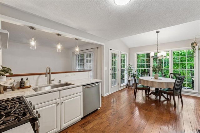 2986 Edenberry Ln NW, Kennesaw, GA 30152 - kitchen with dishwasher, a sink, black range with gas stovetop, healthy amount of natural light, and a textured ceiling