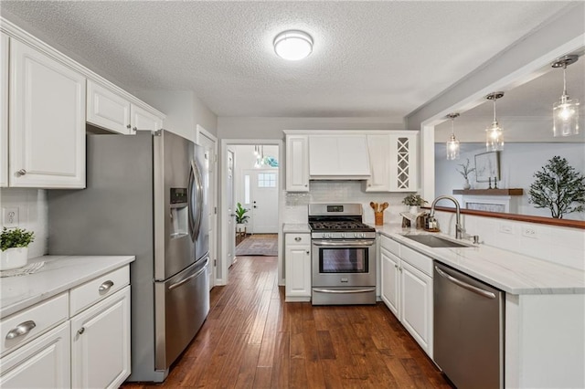 2986 Edenberry Ln NW, Kennesaw, GA 30152 - kitchen featuring appliances with stainless steel finishes, a sink, a textured ceiling, white cabinetry, and dark wood-style floors