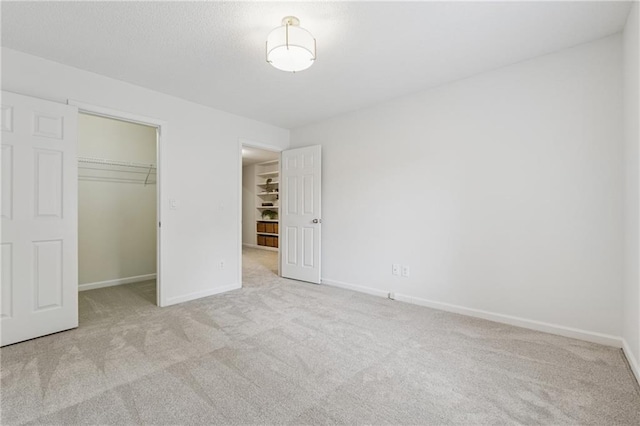 2986 Edenberry Ln NW, Kennesaw, GA 30152 - unfurnished bedroom featuring carpet, a walk in closet, a closet, and baseboards