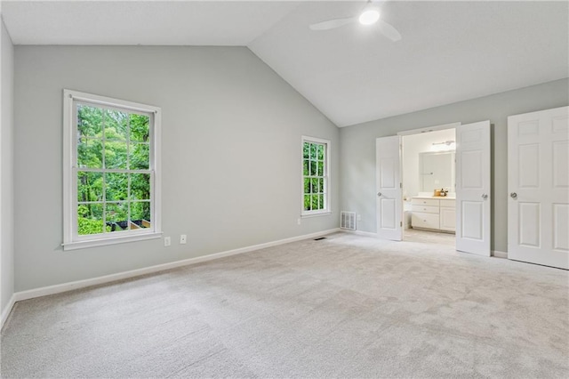 2986 Edenberry Ln NW, Kennesaw, GA 30152 - unfurnished bedroom featuring light colored carpet, multiple windows, baseboards, ensuite bathroom, and high vaulted ceiling