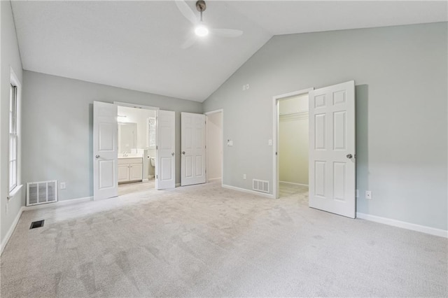 2986 Edenberry Ln NW, Kennesaw, GA 30152 - unfurnished bedroom featuring vaulted ceiling, a spacious closet, light carpet, connected bathroom, and baseboards