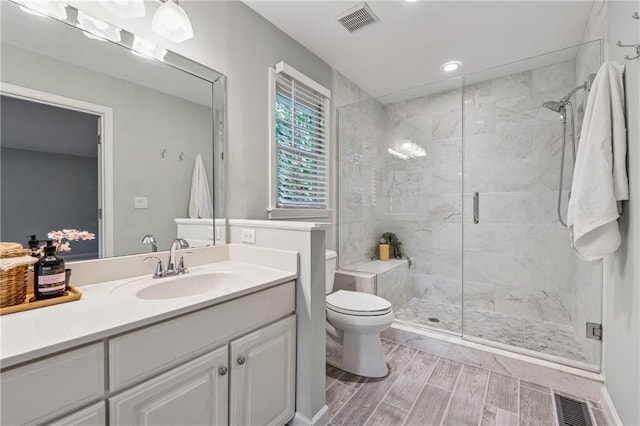 2986 Edenberry Ln NW, Kennesaw, GA 30152 - full bathroom featuring a shower stall, toilet, vanity, wood finish floors, and recessed lighting