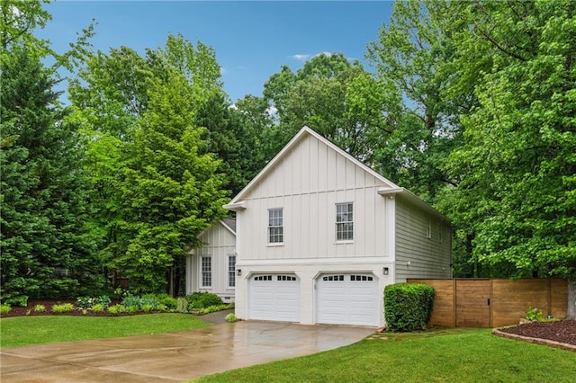 2986 Edenberry Ln NW, Kennesaw, GA 30152 - view of side of home with board and batten siding, driveway, and an attached garage