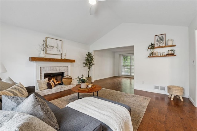 2986 Edenberry Ln NW, Kennesaw, GA 30152 - living area featuring wood-type flooring, lofted ceiling, a ceiling fan, a fireplace, and baseboards