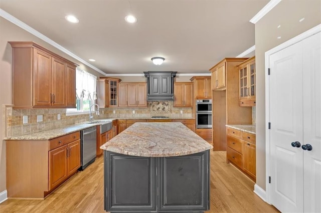 17 River Walk Pkwy, Euharlee, GA 30145 - kitchen featuring a sink, stainless steel appliances, crown molding, light wood-style floors, and glass insert cabinets