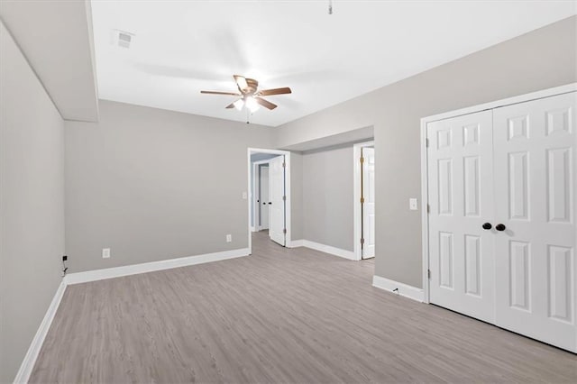 17 River Walk Pkwy, Euharlee, GA 30145 - unfurnished bedroom featuring wood finished floors, baseboards, a closet, and a ceiling fan