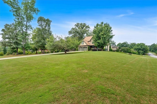 17 River Walk Pkwy, Euharlee, GA 30145 - view of green lawn with view of wooded area